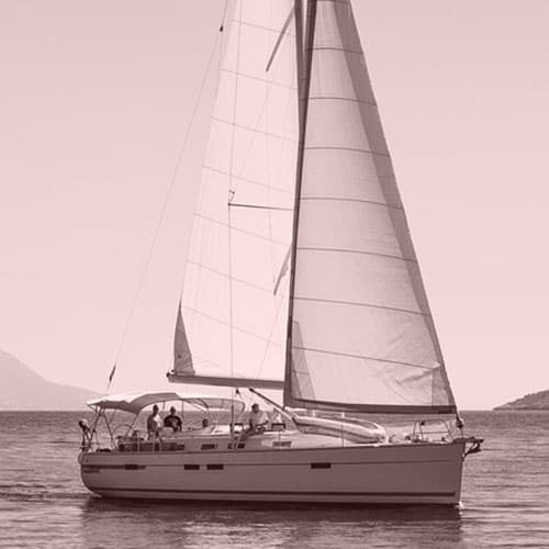 Sailing yacht in the sea against the backdrop of mountains